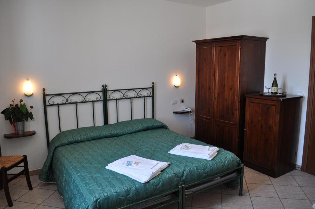 Postel nebo postele na pokoji v ubytování Agriturismo Ai Piacentini