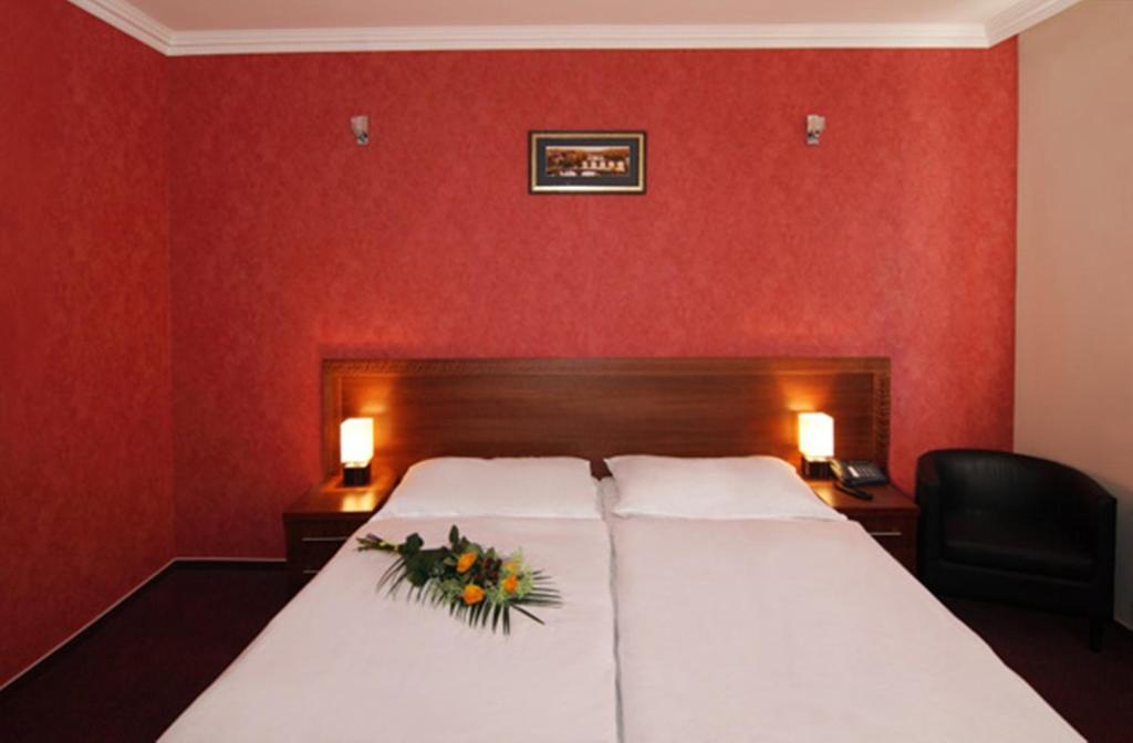 Postel nebo postele na pokoji v ubytování Relax Inn