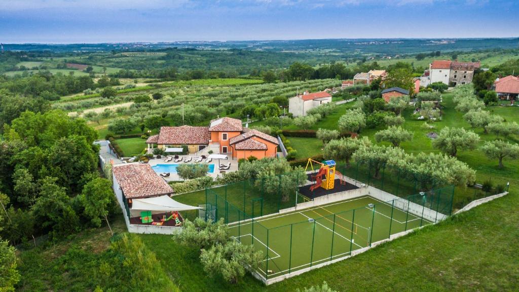 an aerial view of a house with a playground at Villa GioAn - max 18, Private Playground and Sea View in Materada