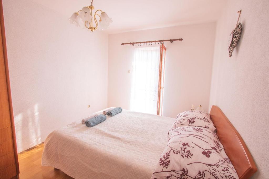 Postel nebo postele na pokoji v ubytování Kristian Apartments