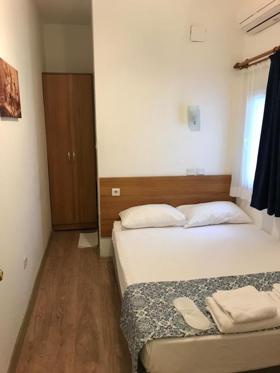 Postel nebo postele na pokoji v ubytování Tay Pansiyon