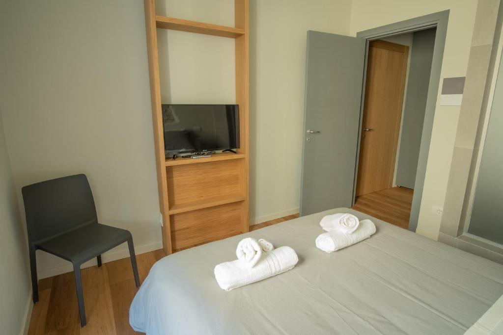 Postel nebo postele na pokoji v ubytování Chill in Tuscany