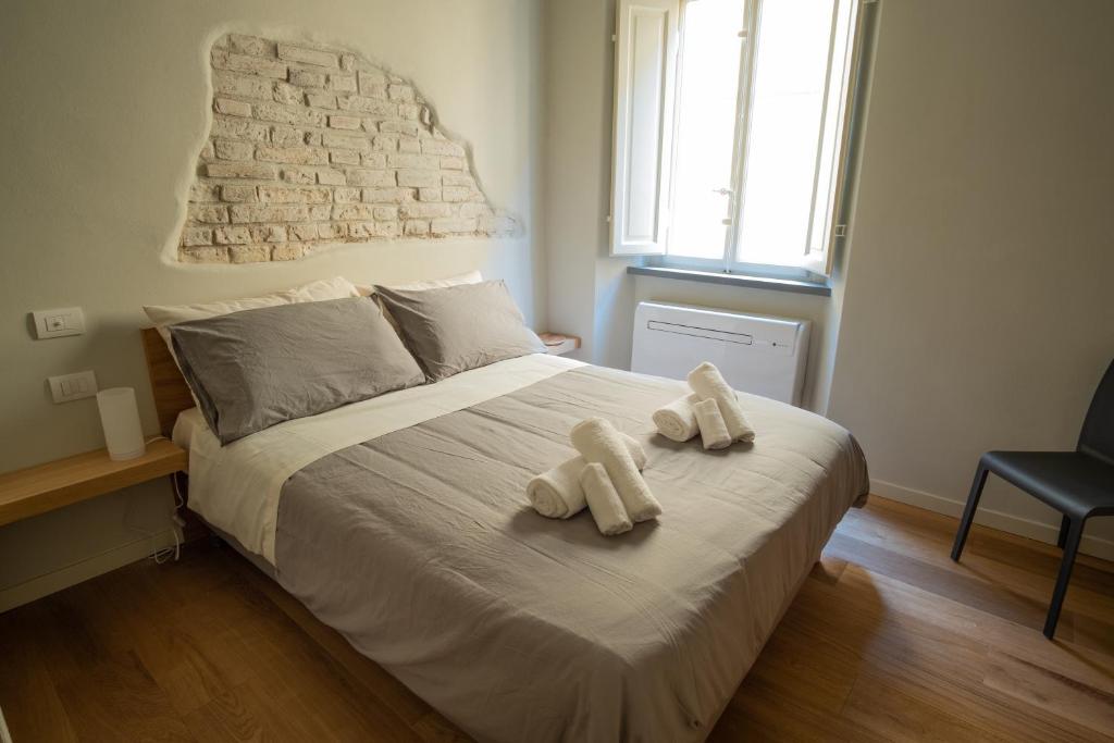 Postel nebo postele na pokoji v ubytování Chill in Tuscany