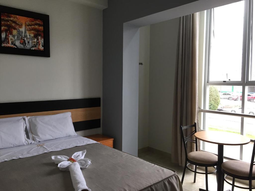 Ένα ή περισσότερα κρεβάτια σε δωμάτιο στο Hostal Parisuite