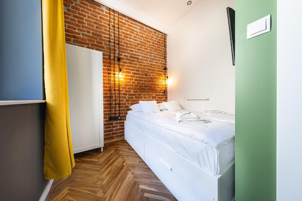Posteľ alebo postele v izbe v ubytovaní MioMio Apartments