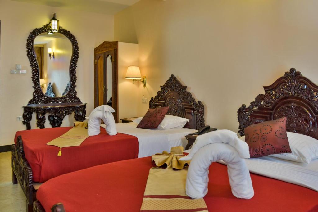 Postel nebo postele na pokoji v ubytování Tembo Palace Hotel