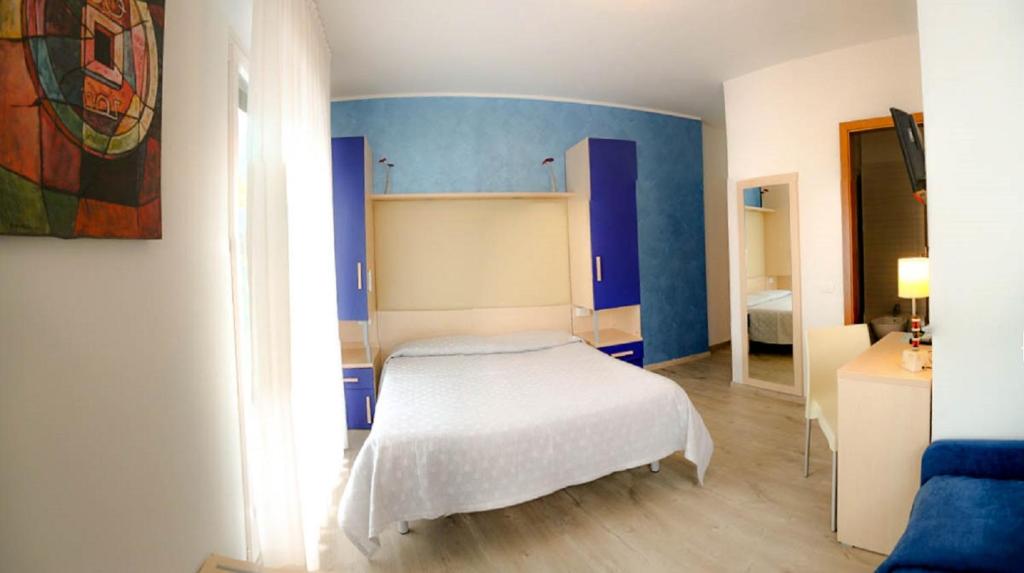 Postel nebo postele na pokoji v ubytování Hotel Alpino