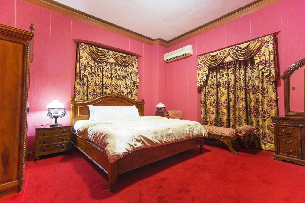 Postel nebo postele na pokoji v ubytování My Vigan Home Hotel