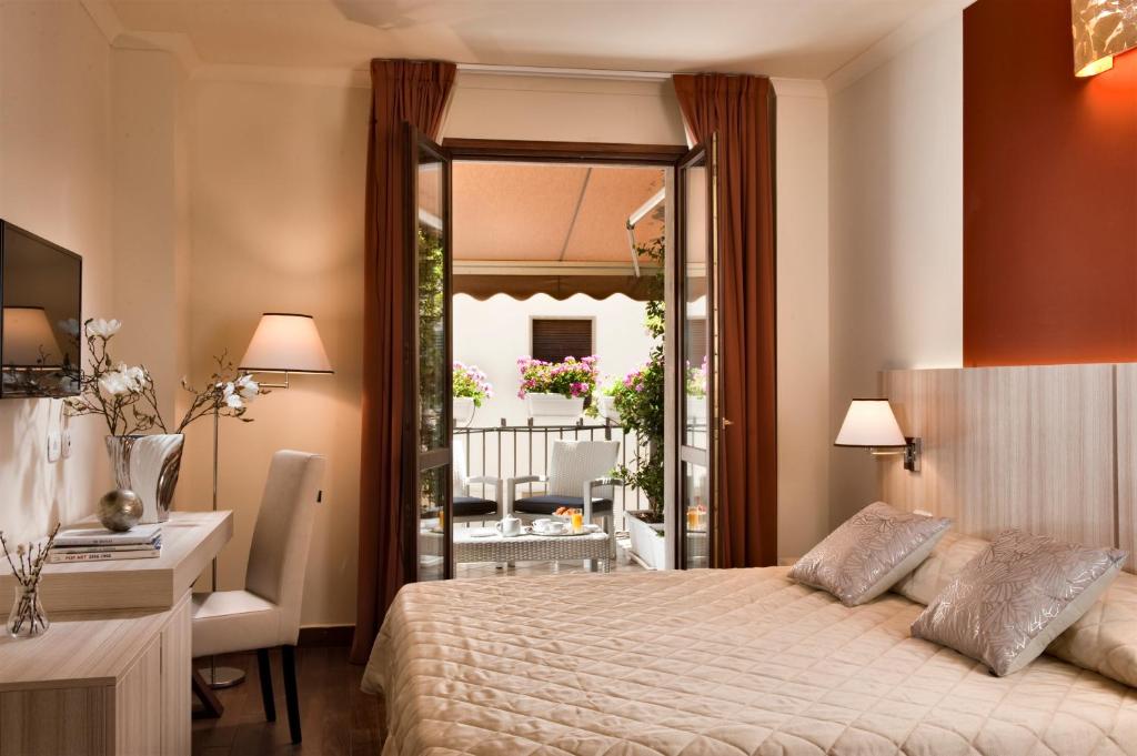 Postel nebo postele na pokoji v ubytování Hotel della Signoria