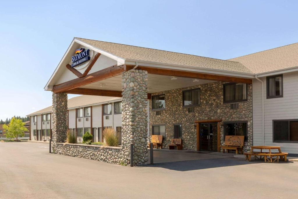 a inn with a sign on the front of it at Baymont by Wyndham Whitefish in Whitefish