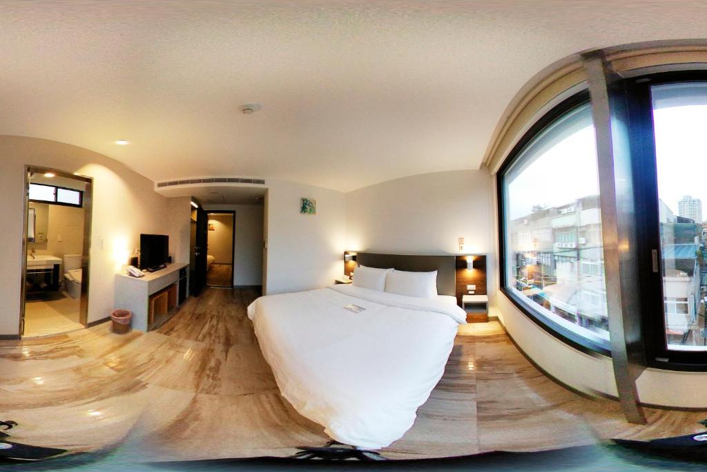 Postel nebo postele na pokoji v ubytování Greatt Hotel