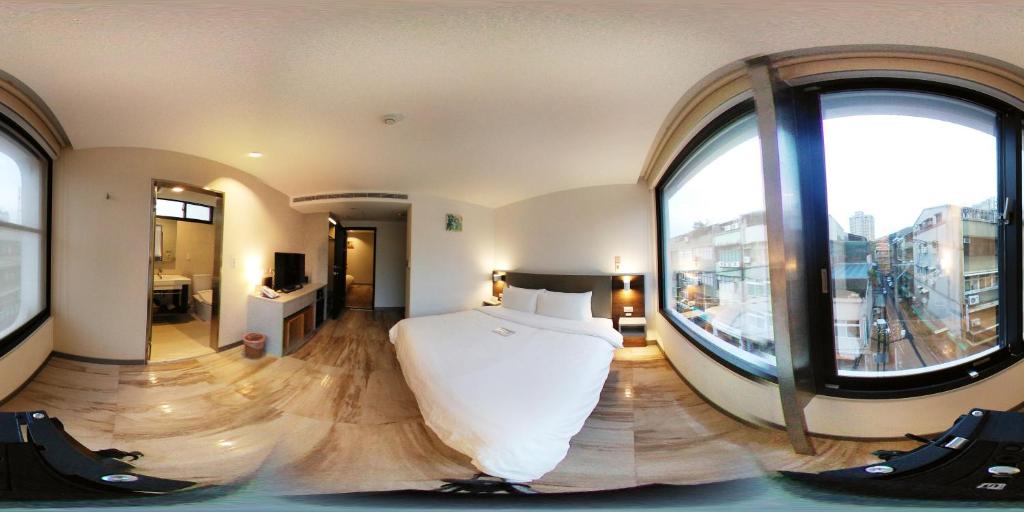 Postel nebo postele na pokoji v ubytování Greatt Hotel
