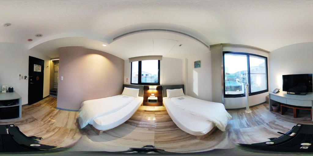 TV a/nebo společenská místnost v ubytování Greatt Hotel