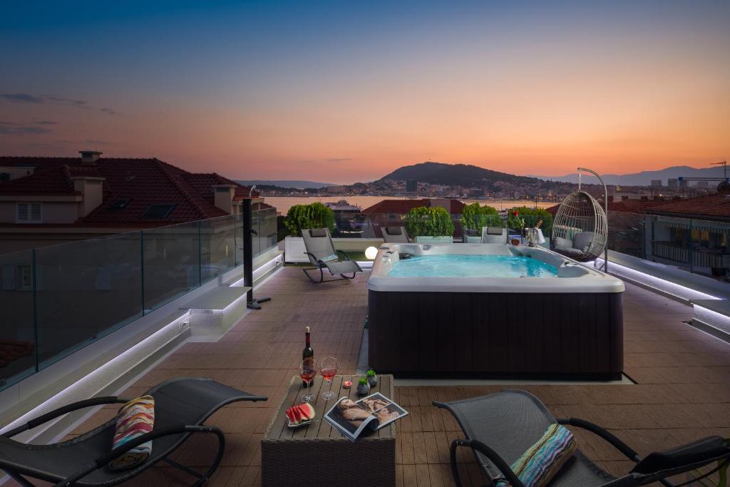 a hot tub on the roof of a building at Villa Muller Apartments in Split