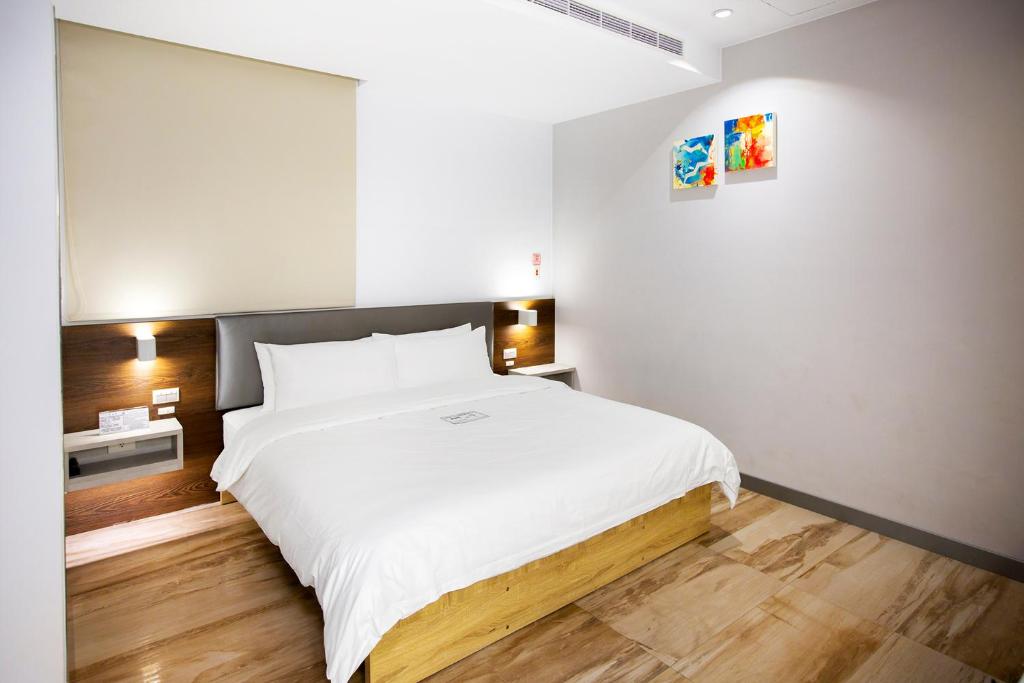 Postel nebo postele na pokoji v ubytování Greatt Hotel