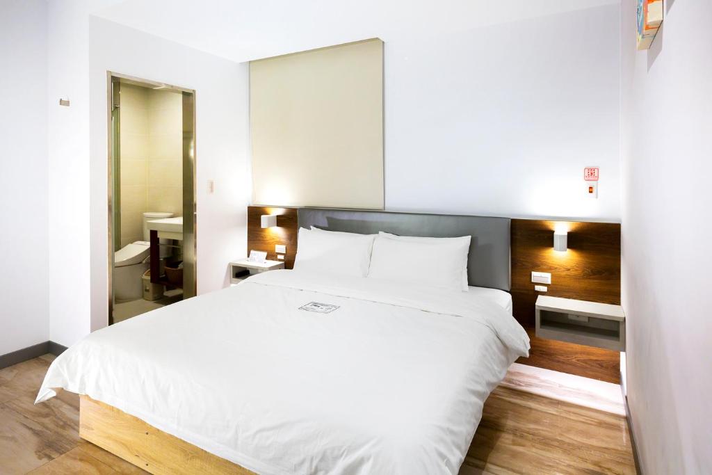 Postel nebo postele na pokoji v ubytování Greatt Hotel