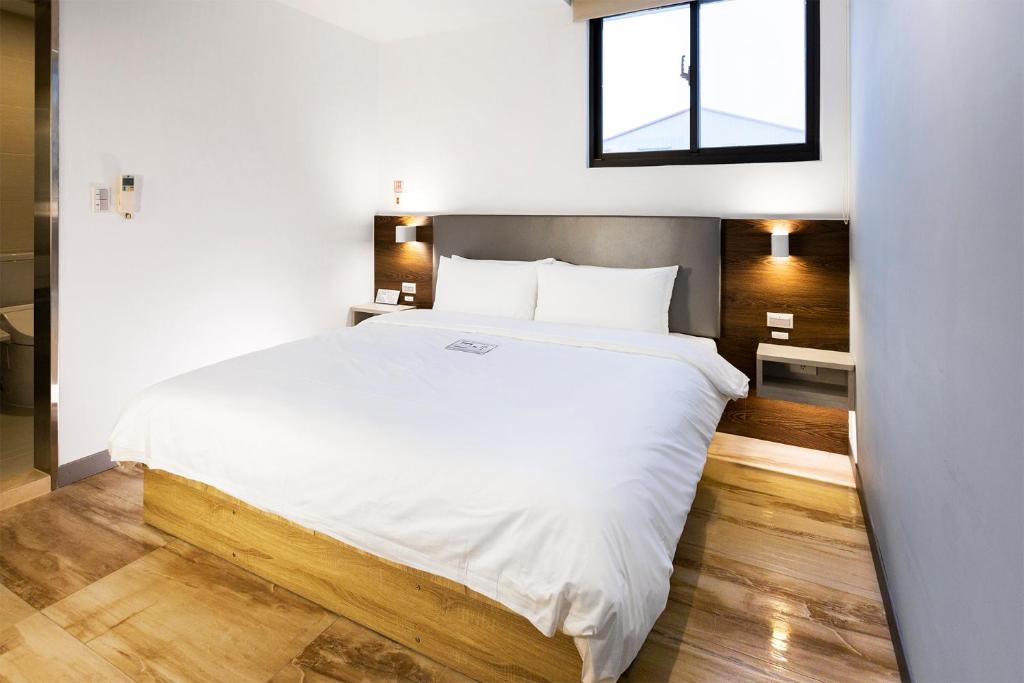 Postel nebo postele na pokoji v ubytování Greatt Hotel