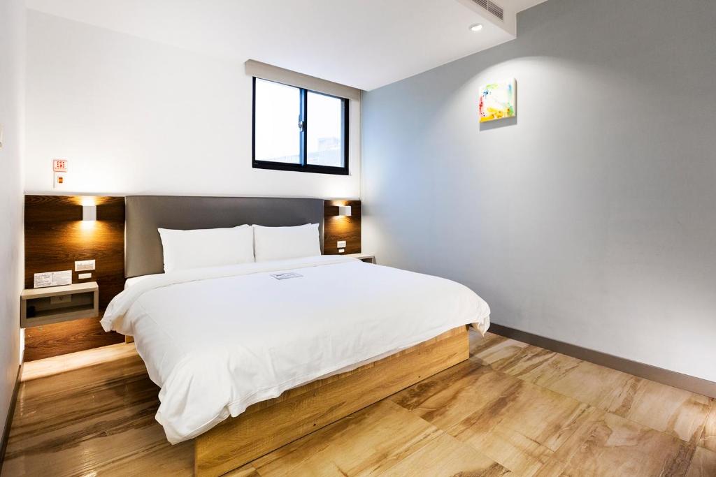 Postel nebo postele na pokoji v ubytování Greatt Hotel