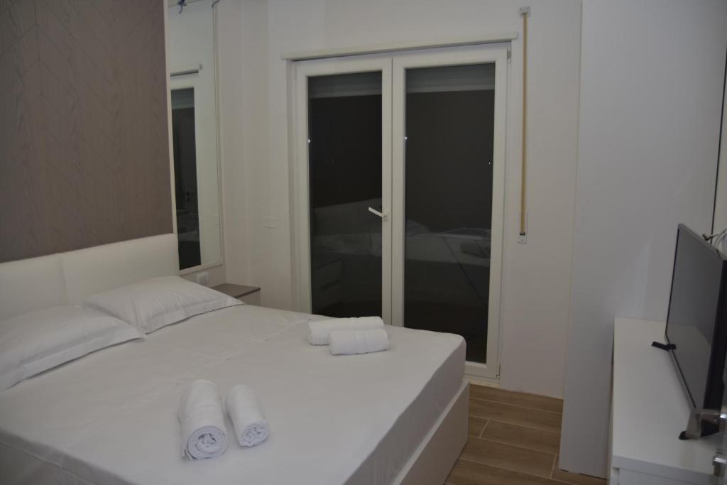 Postelja oz. postelje v sobi nastanitve Airen Hotel Velipoje