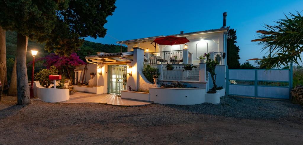 a house with an open door at night at Villa Primaluce in Pizzo