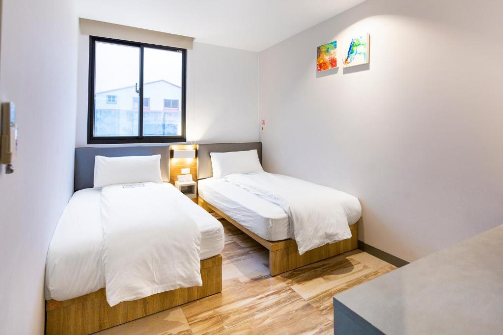 Postel nebo postele na pokoji v ubytování Greatt Hotel