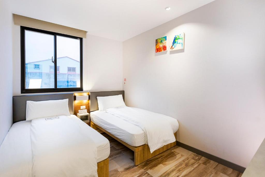 Postel nebo postele na pokoji v ubytování Greatt Hotel
