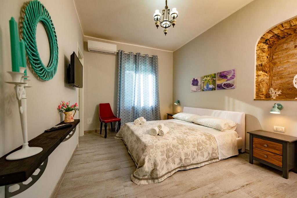 Postel nebo postele na pokoji v ubytování Villa Primaluce