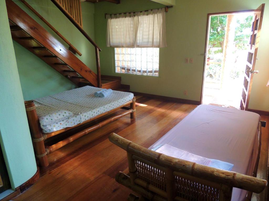 Postel nebo postele na pokoji v ubytování Coral Cay Resort, Inc.