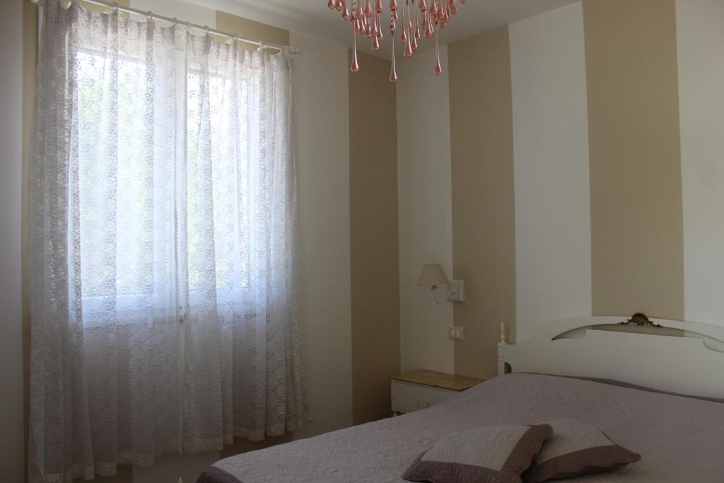 Postel nebo postele na pokoji v ubytování La Lanterna delle Fate