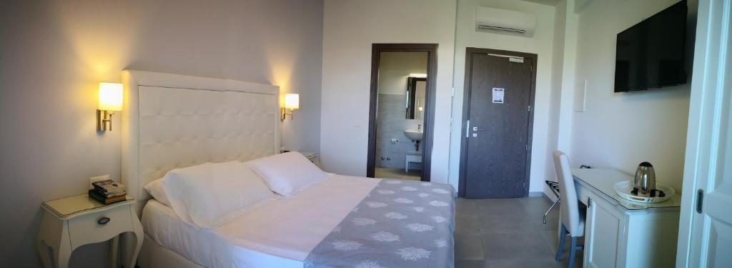 Postel nebo postele na pokoji v ubytování Hotel Puglia Garden