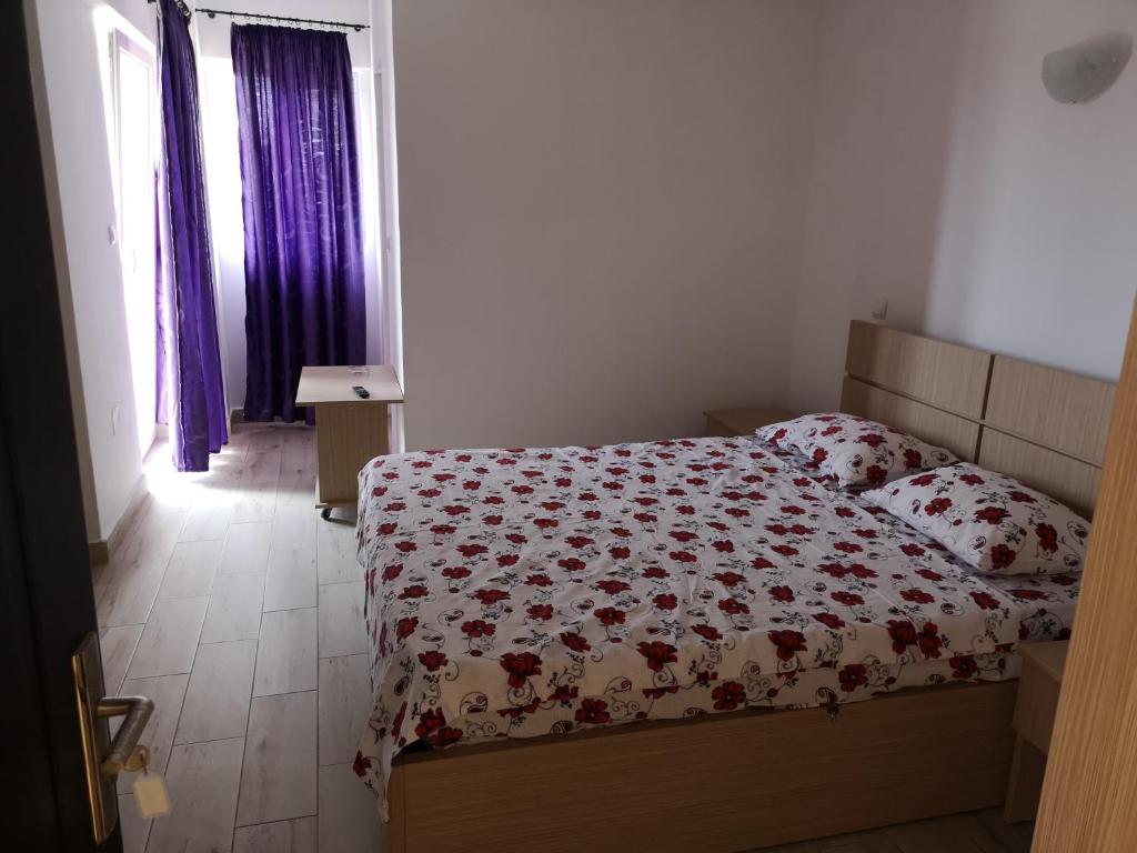 Postel nebo postele na pokoji v ubytování Vila Axel