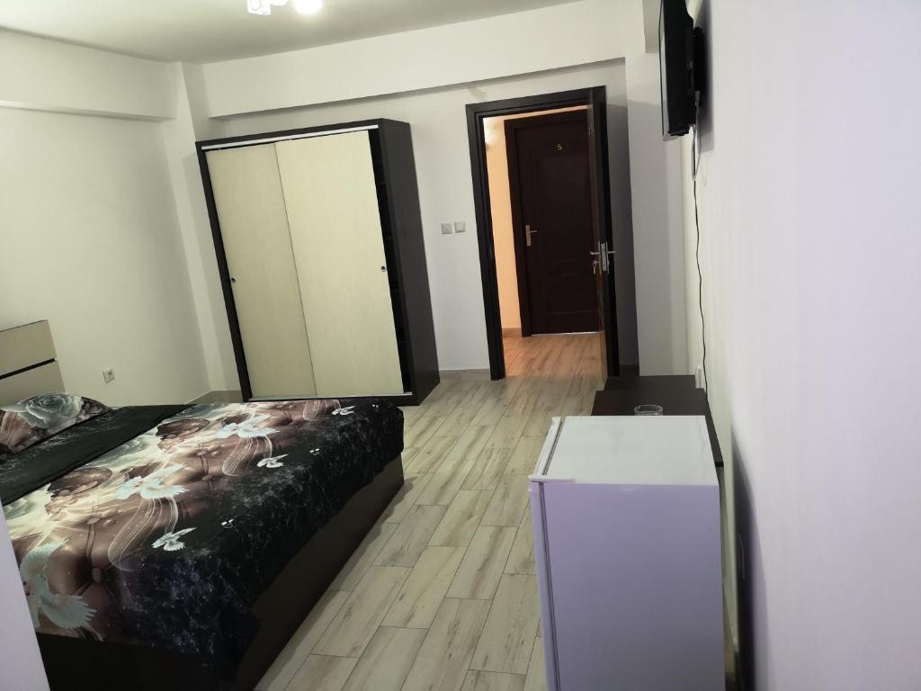 Postel nebo postele na pokoji v ubytování Vila Axel