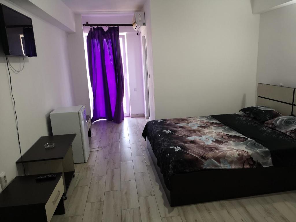 Postel nebo postele na pokoji v ubytování Vila Axel