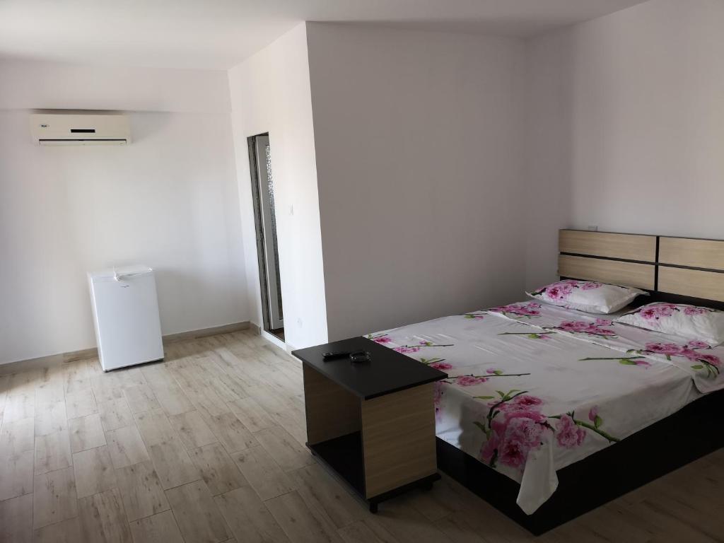 Postel nebo postele na pokoji v ubytování Vila Axel
