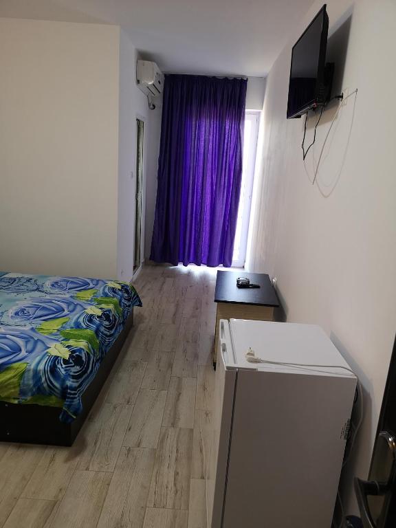 Postel nebo postele na pokoji v ubytování Vila Axel