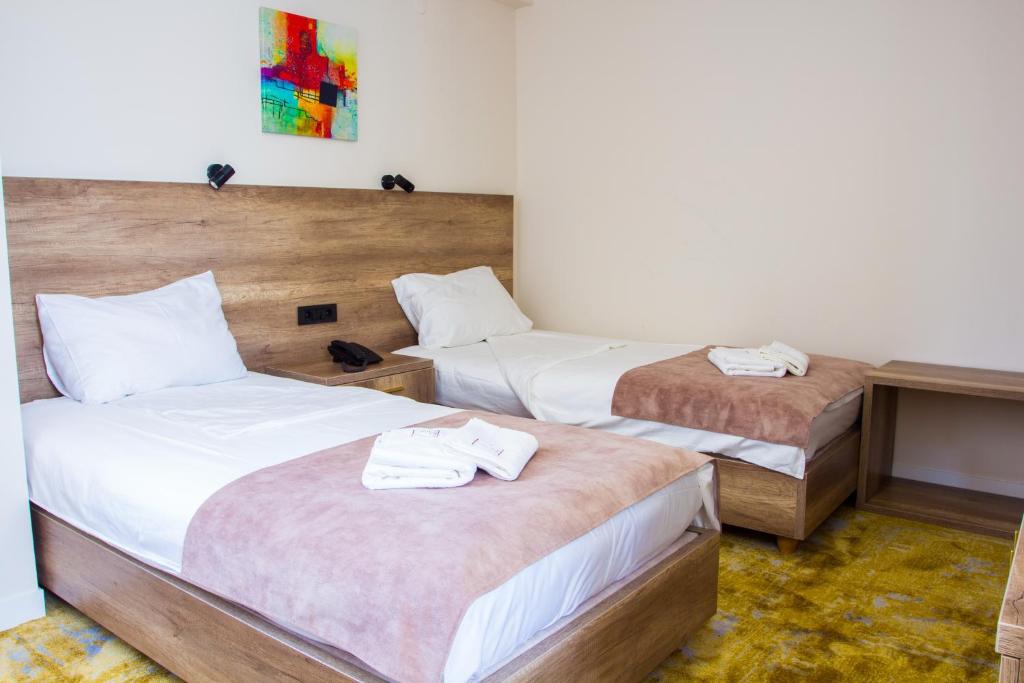 Postel nebo postele na pokoji v ubytování Hotel Skopje