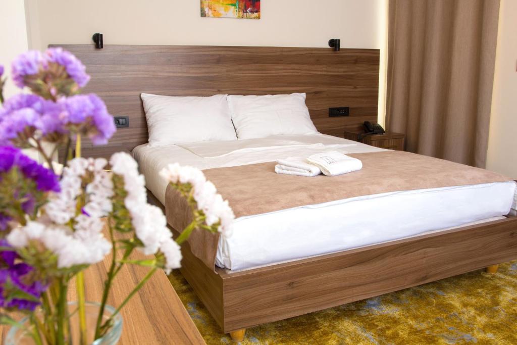 Postel nebo postele na pokoji v ubytování Hotel Skopje