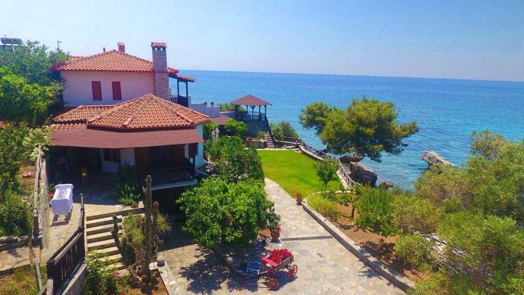 a house with a view of the ocean at Seaside 1 in Agia Paraskevi