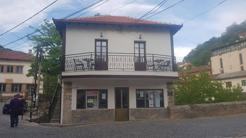a building with a balcony on top of it at Bridge Apartment in Kratovo