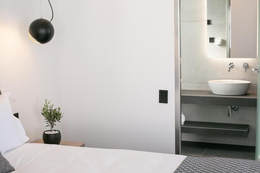 Łóżko lub łóżka w pokoju w obiekcie Kallos Imar Boutique Hotel