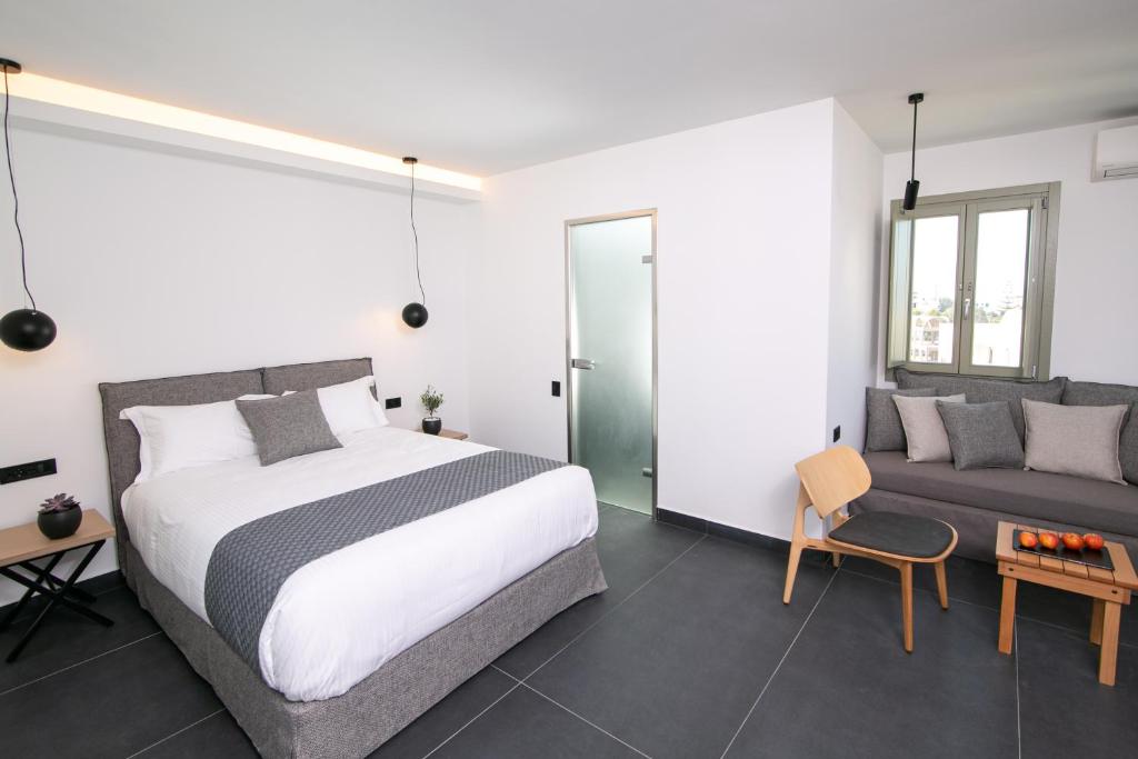 Łóżko lub łóżka w pokoju w obiekcie Kallos Imar Boutique Hotel