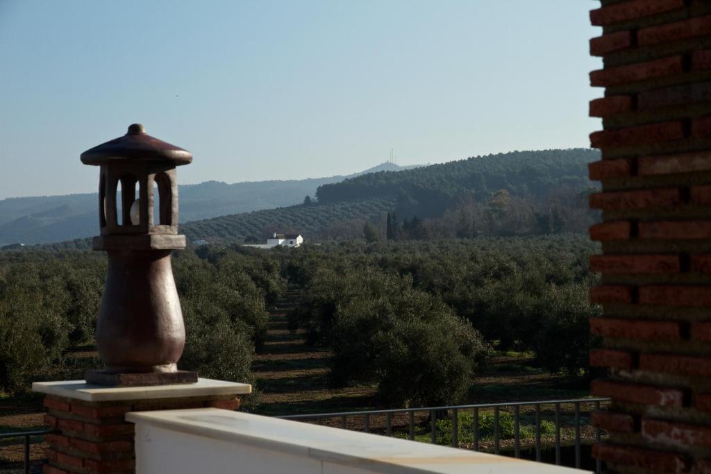 a balcony with a view of a field of trees at Los Dólmenes in Antequera