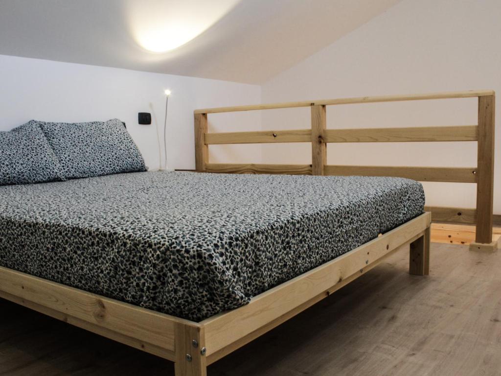 Кровать или кровати в номере La Dimora apartments