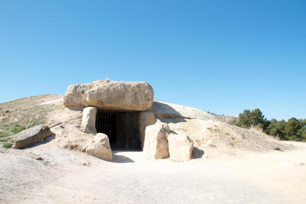 a cave in a rock in the desert at Los Dólmenes in Antequera