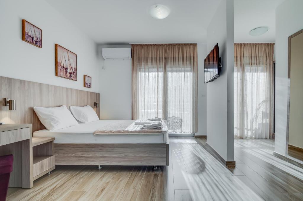 Postel nebo postele na pokoji v ubytování Adriatik Lux Apartments