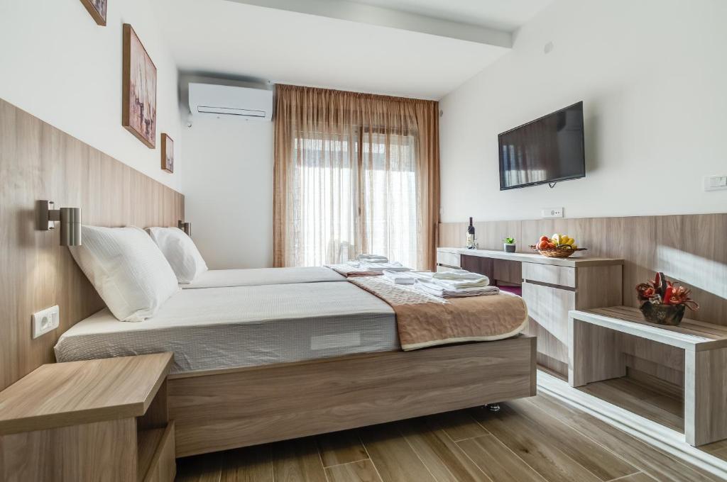 Postel nebo postele na pokoji v ubytování Adriatik Lux Apartments
