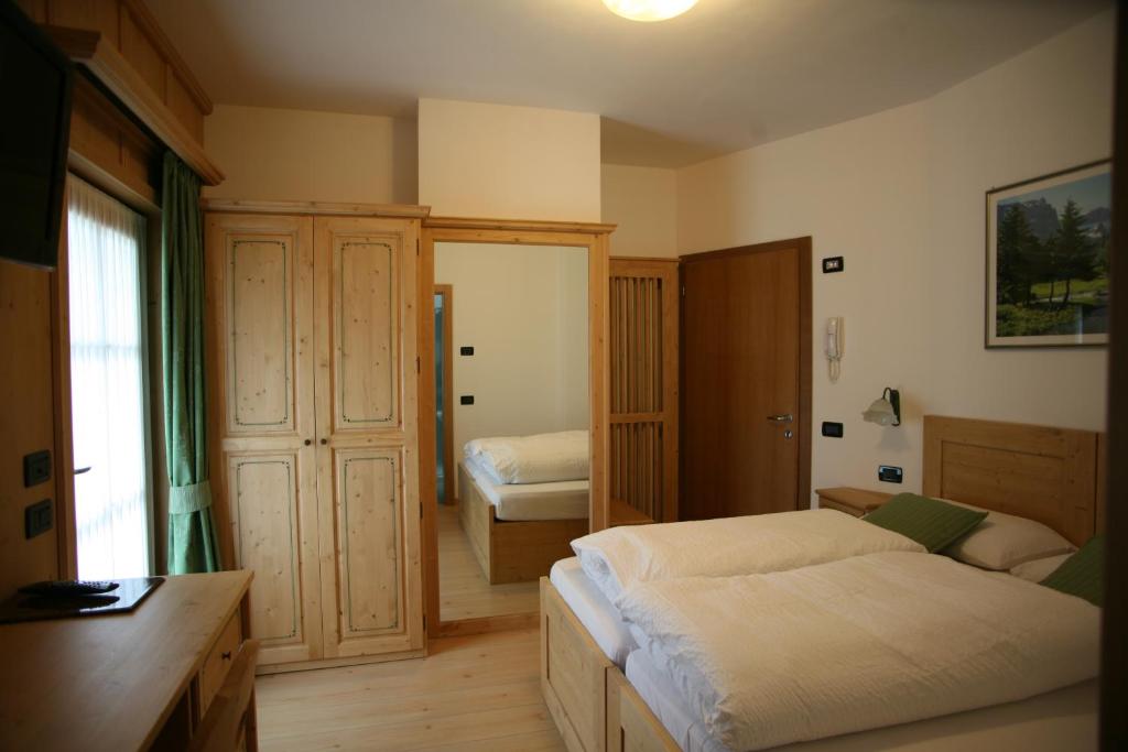Posteľ alebo postele v izbe v ubytovaní B&B Rendena Chalet