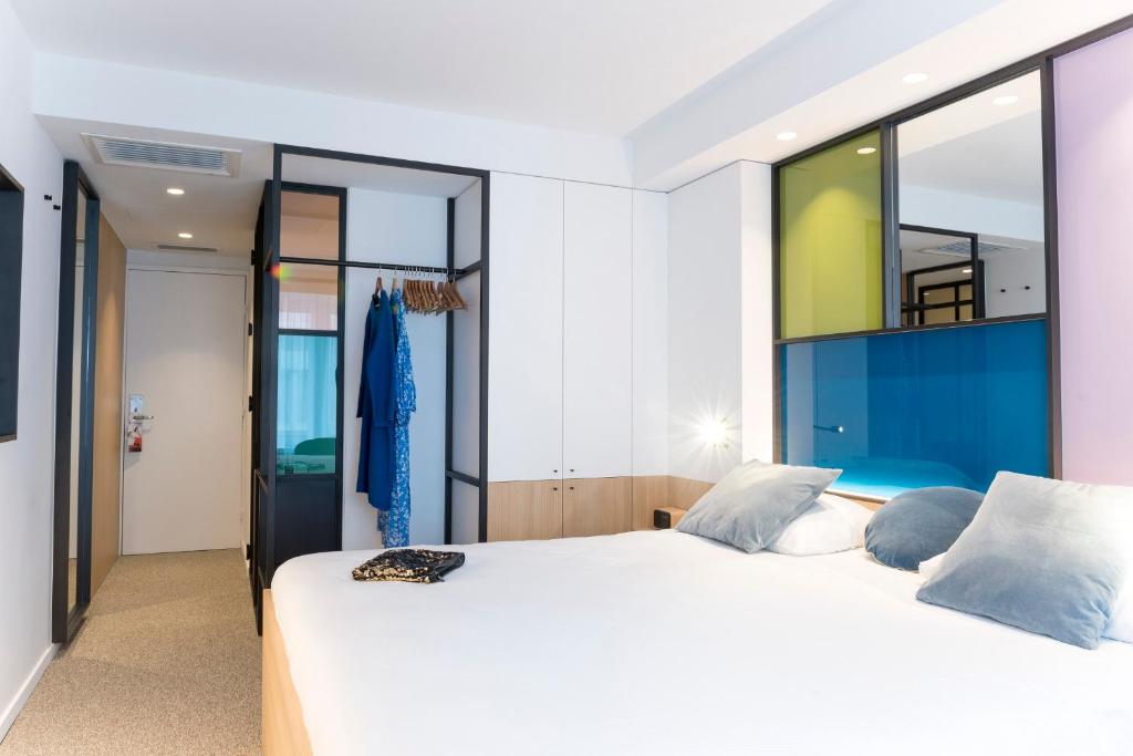 Postel nebo postele na pokoji v ubytování Hotel Nelson