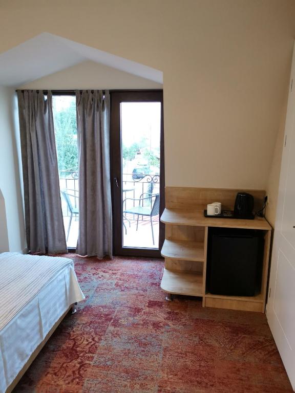 Postel nebo postele na pokoji v ubytování Boutique Hotel BelleVue