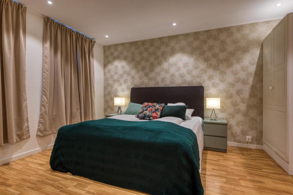 Postel nebo postele na pokoji v ubytování Trondheim Leilighetshotel